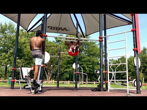 Scissor kicks on the pull-up bar with my son Timontae
