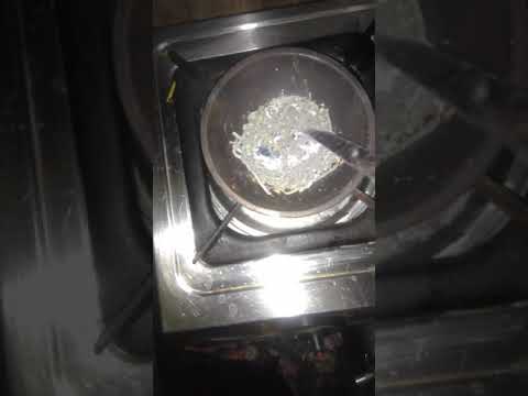 Melting lead extracted from battery in gas oven