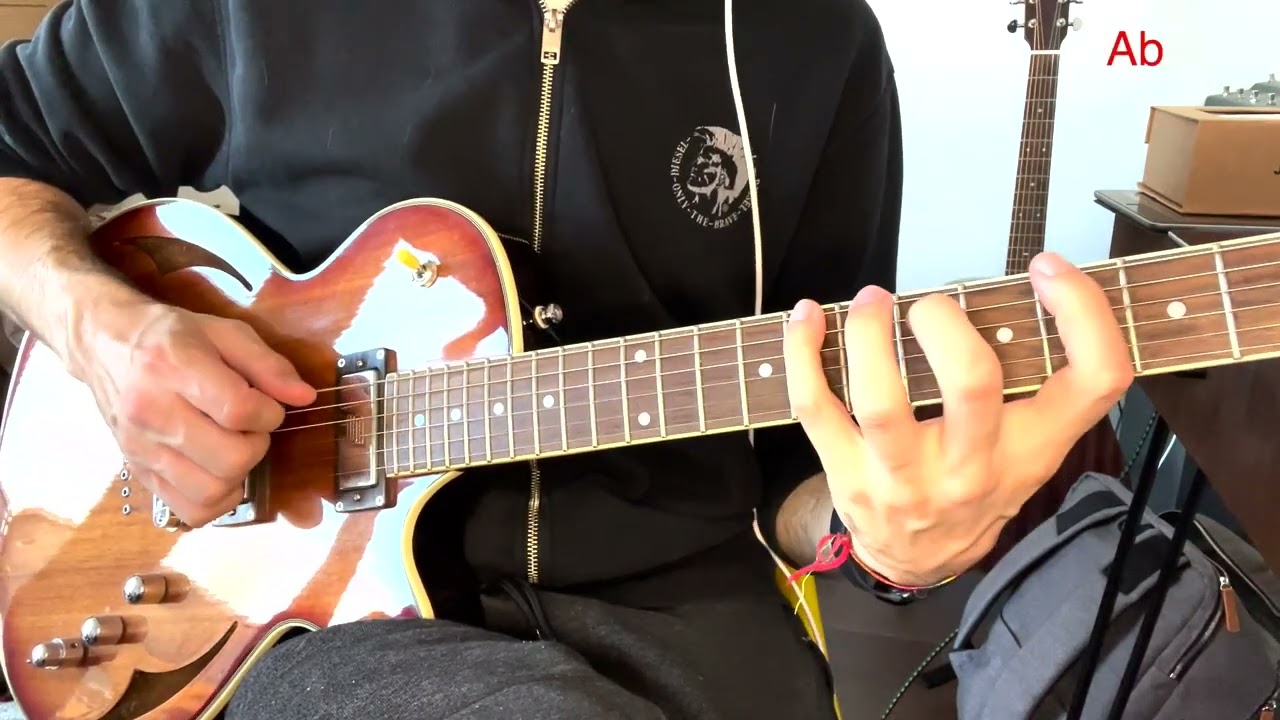 Guitarist demonstrating dominant 7 voice-leading arpeggios around the circle of fourths
