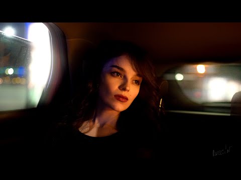 Backstage of a portrait photo shoot with an expressive model