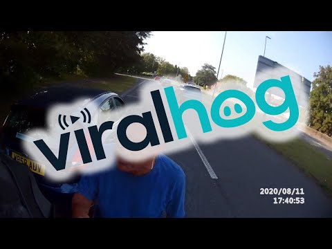 Cyclist and Driver Have Roadside Altercation over Close Pass || ViralHog
