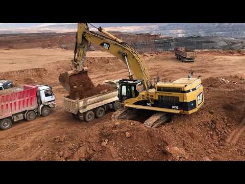 Two Caterpillar 365C Excavator Loading Man And Mercedes Trucks
