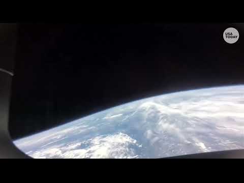 Earth comes into view out Integrity's window, Artemis II crew re-enters atmosphere before splashdown