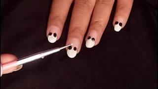 You can get the ear shapes using the head of match and then make the smaller details with a needle or tiny paintbrush.