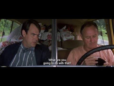 Gene Hackman rolling in a moving car in Loose Cannons (1990)