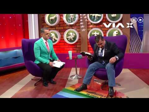 An evangelical pastor steps on an LGBT flag on television.