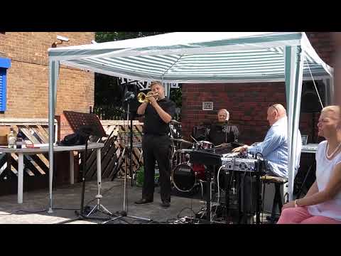 John Evans keyboards Malcolm Garrett drums and Antonio Socci cornet and vocals.