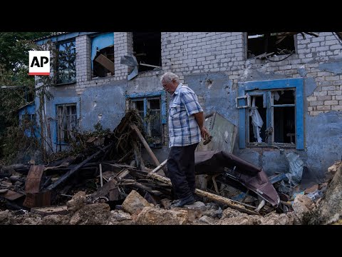 Ukrainians survey damage in Kherson after Russian attack