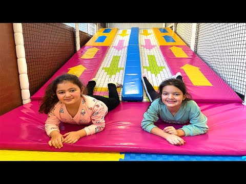 Masal and Öykü  have fun playing at the Indoor Playground for kids