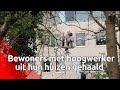 Bewoners met hoogwerker uit hun huizen gehaald