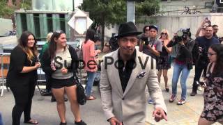 Nick Cannon poses outside the Mercedes-Benz Fashion Week ...