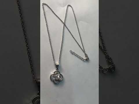 Silver flower pendant with cz stone