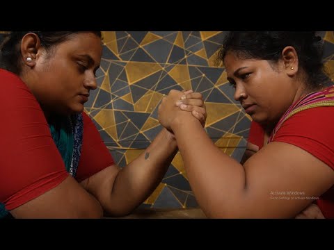 A test of strength wrestling match between two hotel receptionists