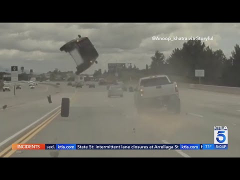 Runaway tire sends car flying into the air