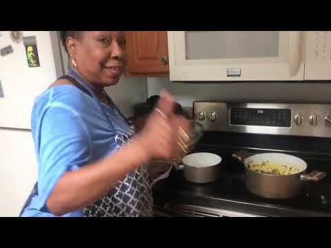 American lady cooking African food / Eforiro/ vegetable soup