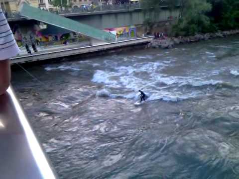 Surfing on a swollen River Mura In Graz  Austria