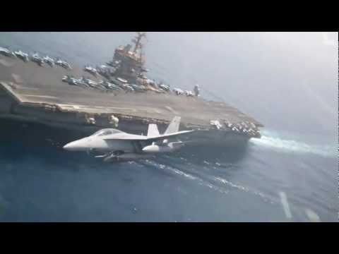 Strike Fighter Squadron Flies Over Flight Deck of USS Enterprise Aircraft Carrier
