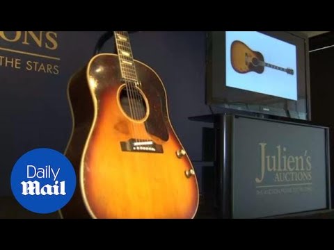 John Lennon's missing guitar goes up for auction - Daily Mail