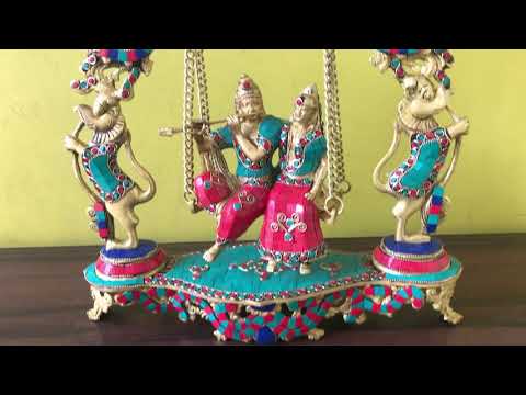 Brass radha krishna swing on jhula with kirtimukha at top wi...