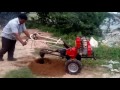 EARTH AUGER OPERATED BY HAND ROTARY TILLER