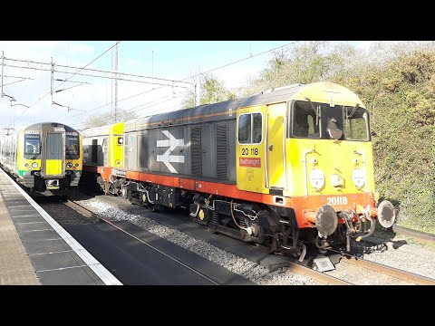 20118 + 20132 head through Bushy with several pairs of barrier wagons 12/4/21