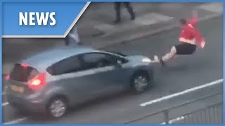 England fan sent flying after mounting a car during World Cup celebration