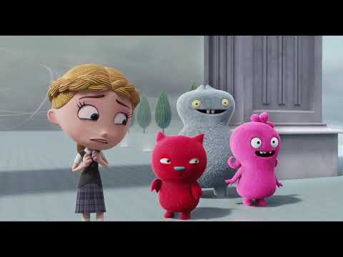 Music-driven set pieces in the trailer — Lou’s stage and Perfection drills in glittering light