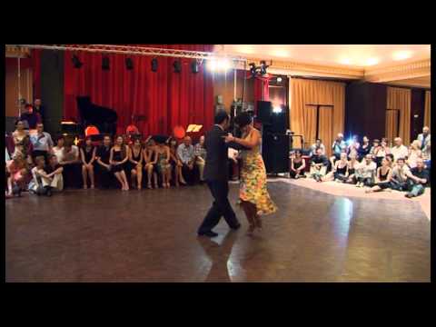  Marcela Guevara  and  Stefano Giudice  are  dancing  to  the  tango  "  Duerme Mi Amor  "  by  Carlos di Sarli  at  Aix Tango Festival  in  2013
