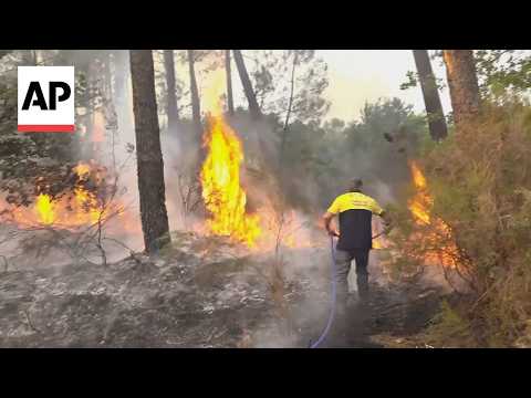 AP reporter shows wildfires burning in France as 250,000 people evacuated so far