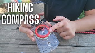 Emergency compass including a survival lanyard with more tools