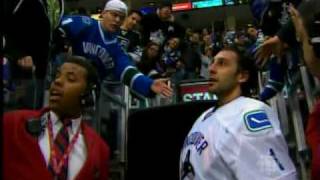 Fan knocks off Luongo's helmet