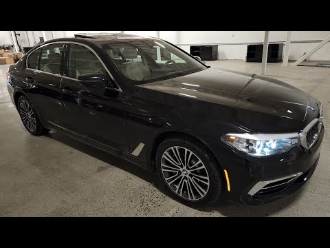 360 Degree exterior of a Black Sapphire Metallic 2020 BMW 530e