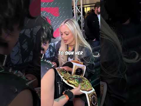 Liv Morgan with a Rhea Ripley fan