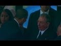 Obama shakes Raul Castros hand - YouTube