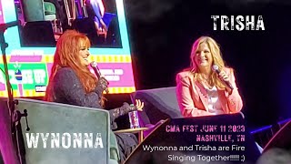 Wynonna Judd and Trisha Yearwood singing together CMA Fest 2023