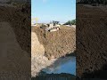 Dozer backfills deep hole