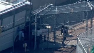 RAW VIDEO: Migrants arrive at South Bay facility