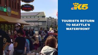 Seattle’s waterfront businesses welcome holiday crowds as more attractions reopen