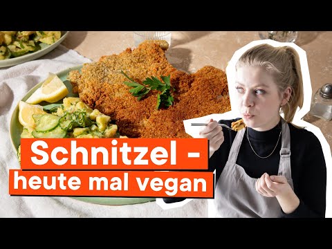 Vegan seitan schnitzel with potato salad and cranberry jam