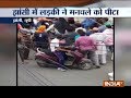 Girl thrashes youth on road over eve-teasing issue in Jhansi