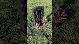 placing flowers at my parent's grave.