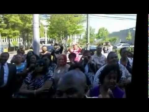 Pastor Joel R. Peebles addresses a crowd of supporters outside of the court-house.wmv