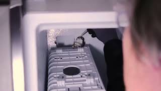 How to disassemble a Frigidaire side-by-side refrigerator ice maker