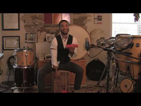 Playing cajon with brushes and shaker