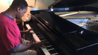 Kris Nicholson playing route 66 on a Baldwin L Grand piano