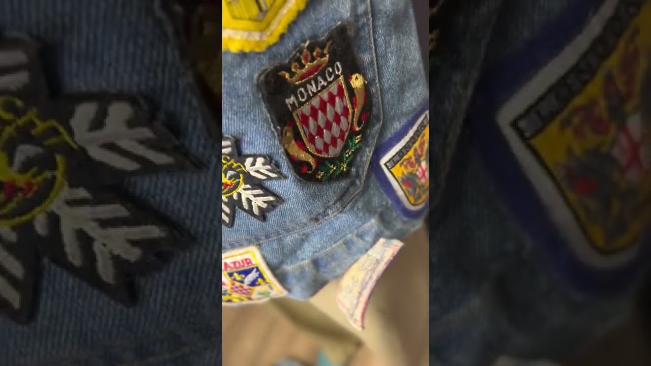 Vintage DKNY denim jacket with tons of travel patches / pins