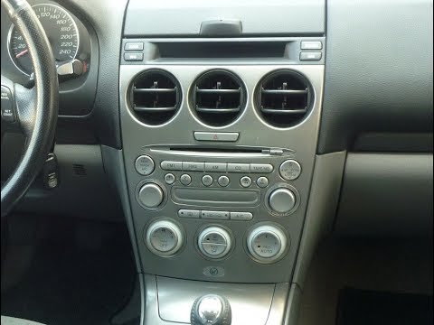 Caravan/Mazda 6 double DIN radio mounting frame in black and silver