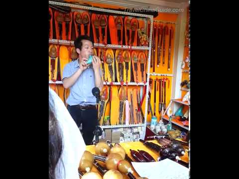 Tocando Ocarina no Xingqing Palace Park, Xian