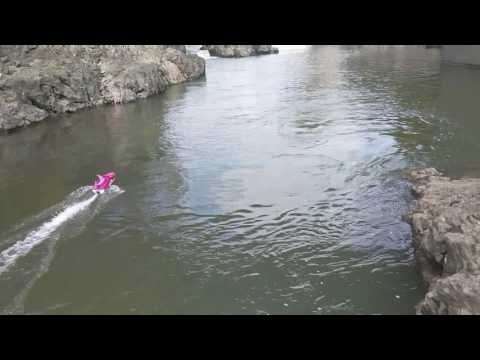Playing at the base of a dam. Thrasher RC Jet boat.