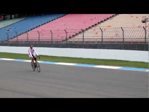 Michael Schumacher drives by on bike [Grosse Preis von Santander von Deutschland]